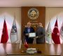 Aksaray Ticaret Borsası Başkanı Hamit Özkök’e Teşekkür Belgesi Takdim Edildi